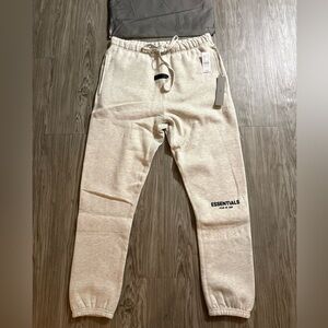 Essentials fear of god sweat pants light oat size medium